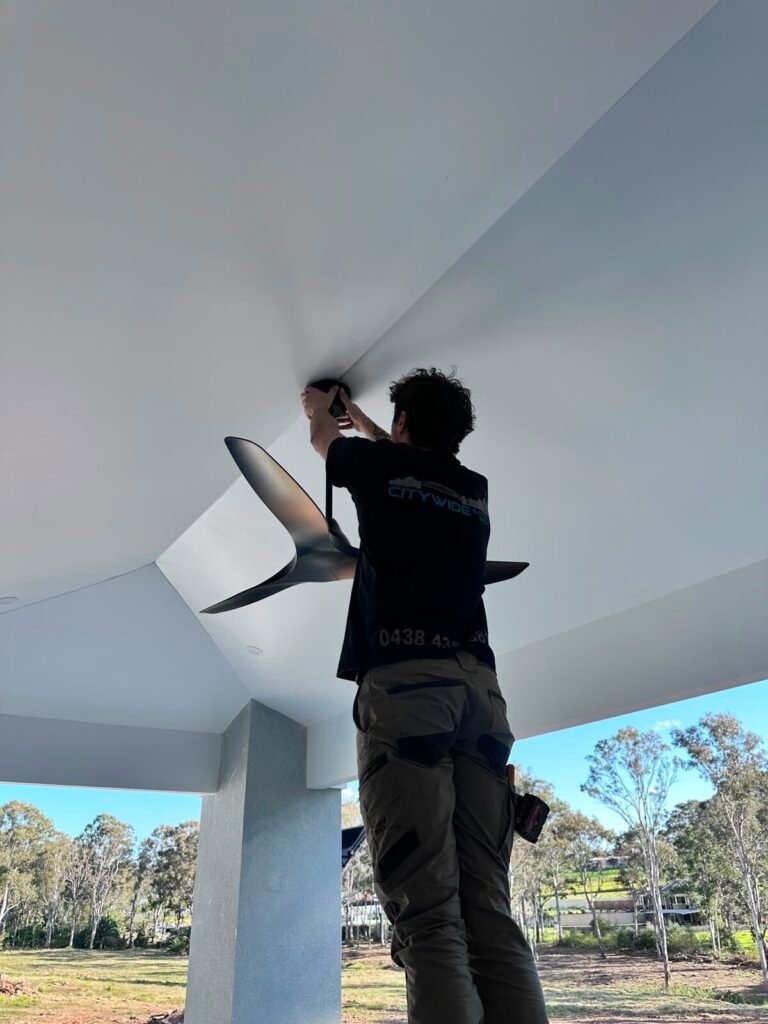 Electrician working on a kitchen oven installation